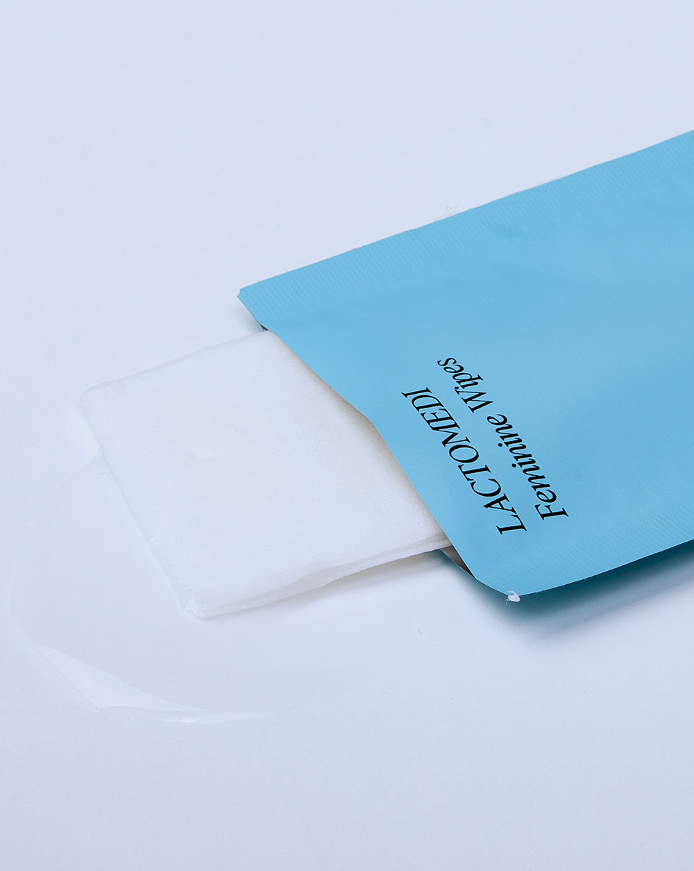 Individual feminine wipes packet opened up
