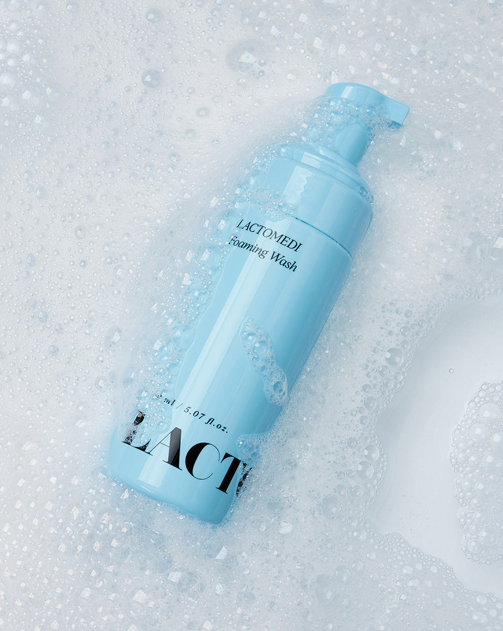 foaming wash bottle surrounded by bubbles