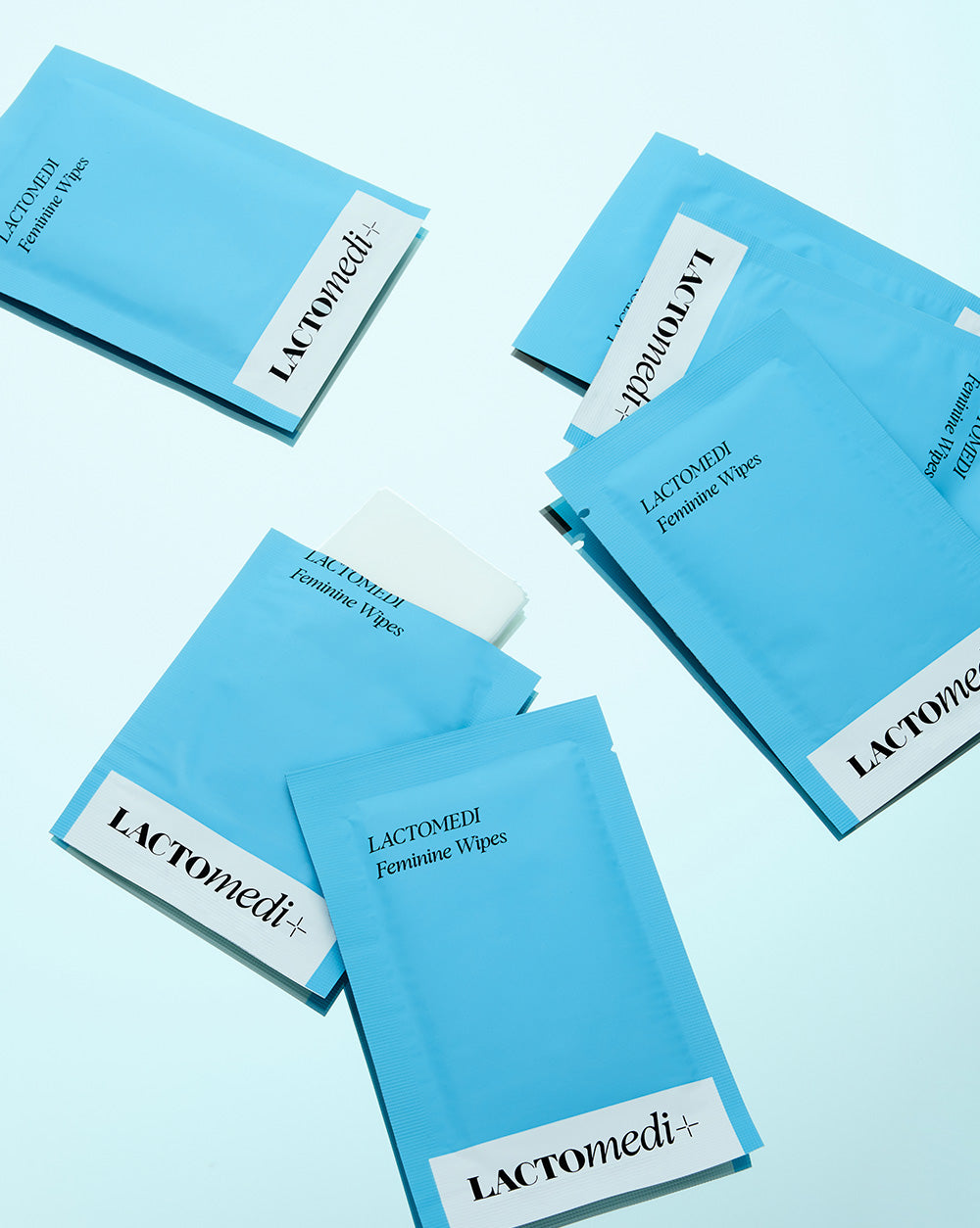 a pile of feminine wipes individual packets